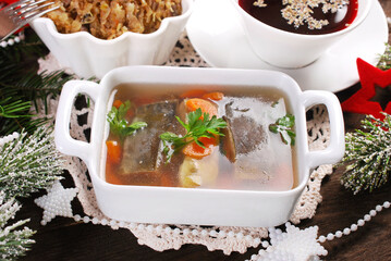  Traditional Christmas Eve carp in jelly, red borscht and sauerkraut with mushrooms