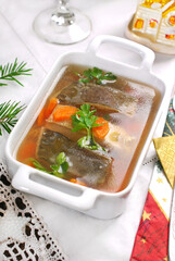 Traditional Christmas Eve carp with vegetable and raisins in jelly