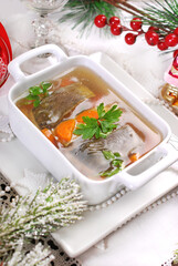 Traditional Christmas Eve carp with vegetable and raisins in jelly