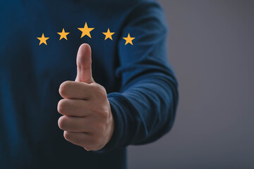 A hand giving a thumbs-up with five golden stars, symbolizing excellent service, high rating, positive feedback, customer satisfaction, and quality assurance in business and professional environments.
