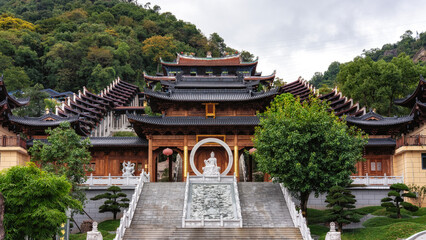 Fototapeta premium Traditional Chinese temple with intricate architecture and surrounding greenery
