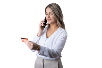 Woman making online payment holding credit card and phone