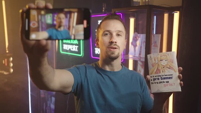 Manga influencer talking about the comic recording video with smartphone 4K