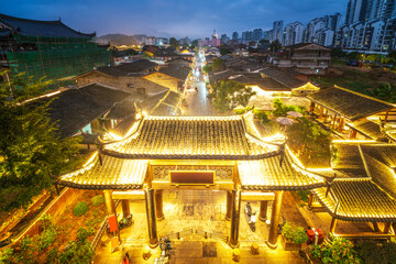 Traditional Chinese architecture with illuminated roofs at night