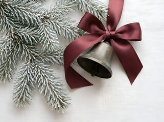 Antique Christmas Bell with Red Ribbon and Frosted Evergreen