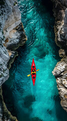 Red Kayak Gliding Through Crystal-Clear Turquoise Canyon Waters