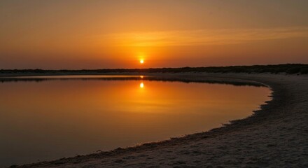 Golden sunset reflecting serenely on tranquil water