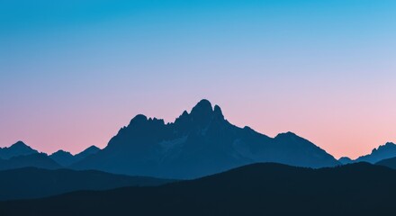 Majestic Mountain Range at Sunset with Pink and Blue Sky