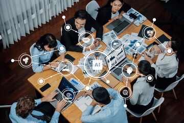 A diverse team of professionals collaborates in a modern office setting, using AI technology and data visualization to enhance strategic decision-making and brainstorming. Amity