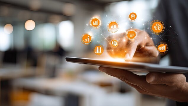 A hand touching a tablet with orange digital icons hovering above, symbolizing data and technology - Powered by Adobe