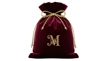 Isolated maroon velvet gift bag with gold letter M embroidery and braided cord tie design