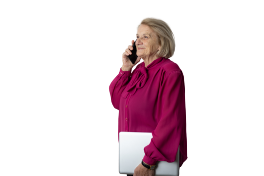Senior businesswoman talking on phone holding laptop - Powered by Adobe