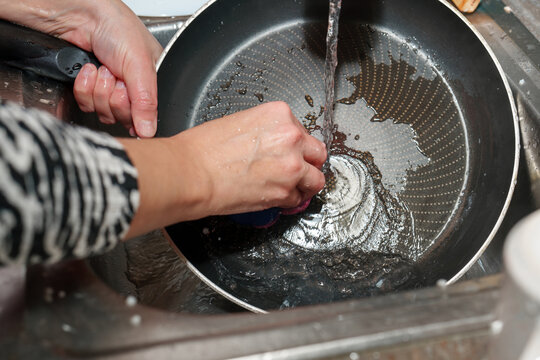 Morning routine includes scrubbing, cleaning, and washing that non stick frying pan after a hearty breakfast