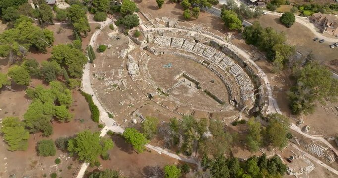 Aerial view of the Greek amphitheater in Syracuse, Sicily, Italy. These are the ruins of an ancient amphitheater located within the Neapolis Archaeological Park. An ancient polis and Greek colony.