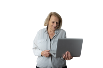Senior woman learning and using laptop computer for digital literacy