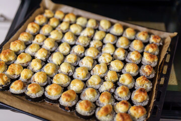 Array of Golden Baked Sushi Rolls Ready to be Served from the Oven