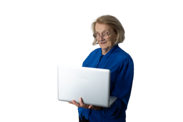 Senior woman smiling using laptop enjoying technology