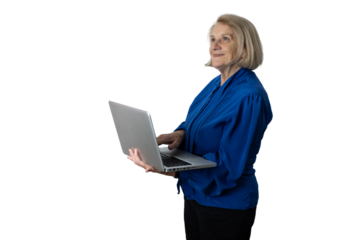Senior woman holding laptop working with technology