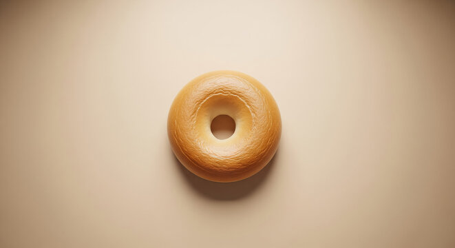 Plain Bagel on Soft Beige Background