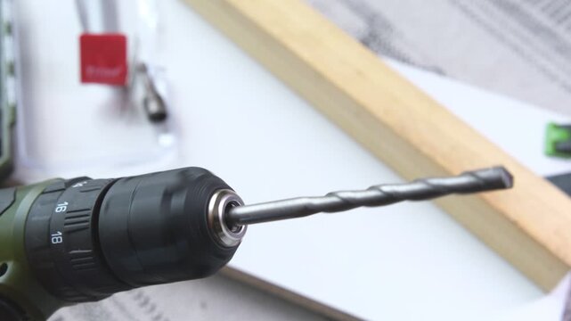 Detailed close-up view of a spinning drill bit on a cordless power tool