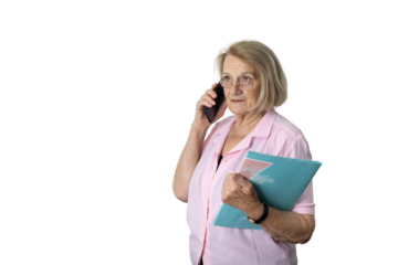 Senior businesswoman talking on phone holding folder