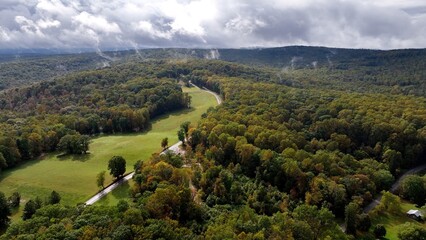 Beautiful scenic countryside with mountains and low clouds over landscape in Ohiopyle, Pennsylvania forest and farmland living the peaceful mountains
