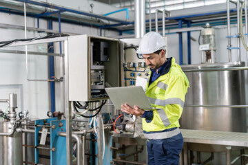 Mechanic or maintenance or electrical engineer checking main electrical control systems industrial plant. Utility fore man daily check power systems in process. Main Distribution Board, Switchboards © Shisu_ka