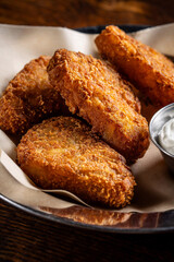 Crispy golden potato croquettes closeup vertical