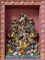 Salzburg - The carved polychrome new gothic relief of Madonna among the Angels with the music...