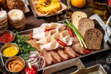 Festive assorted meat and lard platter with sauces