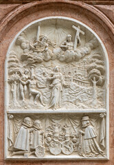 SALZBURG, AUSTIRA - SEPTEMBER 8 2025: The stone relief of Virgin Mary with the Adam and Eva on exterior wall of the chapel Margarethenkapelle in the St. Peter Abtei cemetery by unknown artist.