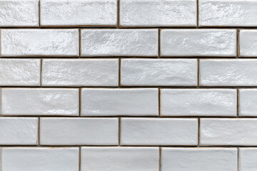 Obraz premium closeup of a light grey glazed subway tile wall with subtle texture
