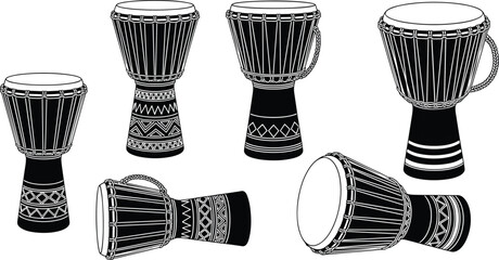 Collection of black and white djembe drums in various positions percussion musical instrument