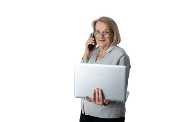 Senior businesswoman working with laptop and phone smiling