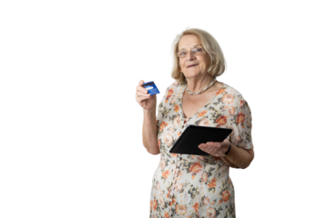 Senior woman holding credit card and digital tablet