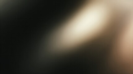 Diagonal beam of warm light diagonally illuminates a dark abstract background