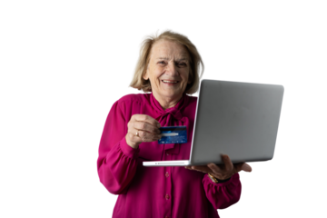 Senior woman doing online shopping holding credit card