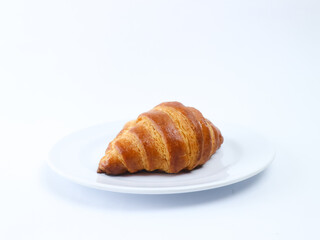 croissant on white plate isolated on white background