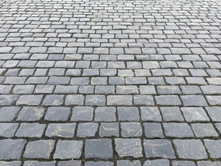 Abstract background. Old cobblestone pavement closeup