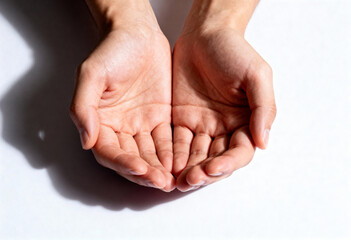 Fototapeta premium Hands in cupped gesture against white background. muslim pray, fathers day for blessings of loved ones