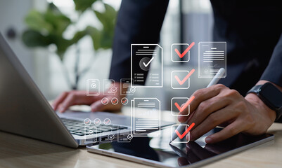 Digital document workflow and quality assurance concept, businessman reviewing electronic files on...