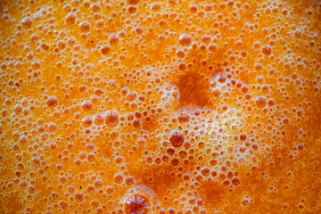 The orange red papaya is beaten into juice and placed in a bowl to prepare for eating