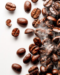 Roasted coffee beans scattered on a white surface with delicate rising steam. Rich aroma and fresh roast concept.
