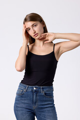 Slavic beauty in black top posing confidently