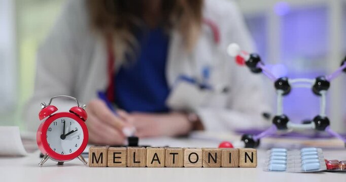 Wooden blocks spell word Melatonin near red alarm clock showing deadline. Woman doctor studies molecule model checking pack with blue tablets