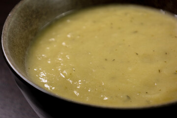 Creamy Potato and Leek Soup on Dark Background &ndash; Cozy Comfort Food