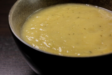 Creamy Potato and Leek Soup on Dark Background – Cozy Comfort Food