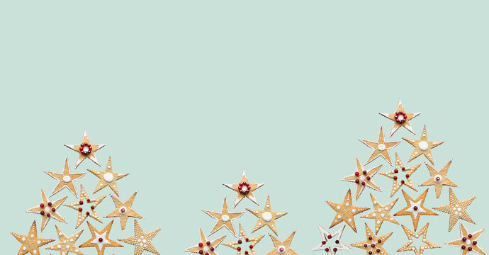 Christmas tree made of ginger star shape sugar cookies. Conceptual Christmas sweet food ornament. Hand decorated food. Isolated. Winter holidays banner, wallpaper, modern minimalist greeting card - Powered by Adobe