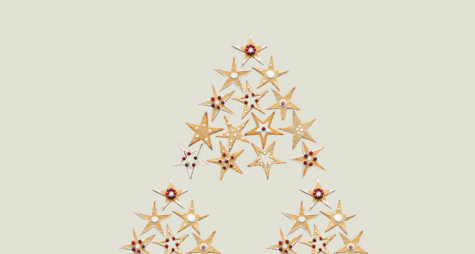 Christmas tree made of ginger star shape sugar cookies. Conceptual Christmas sweet food ornament. Hand decorated food. Isolated. Winter holidays banner, wallpaper, modern minimalist greeting card