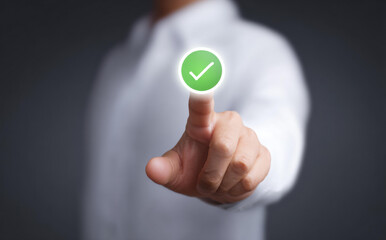 Business person hand pressing virtual green check mark button for approval representing successful positive agreement and correct choice with confidence